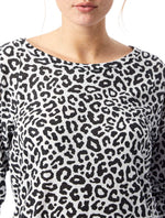 Black/White Leopard printed tee has a relaxed roomy fit, slightly open neckline, and full-length raglan sleeve.