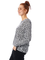 Black/White Leopard printed tee has a relaxed roomy fit, slightly open neckline, and full-length raglan sleeve.