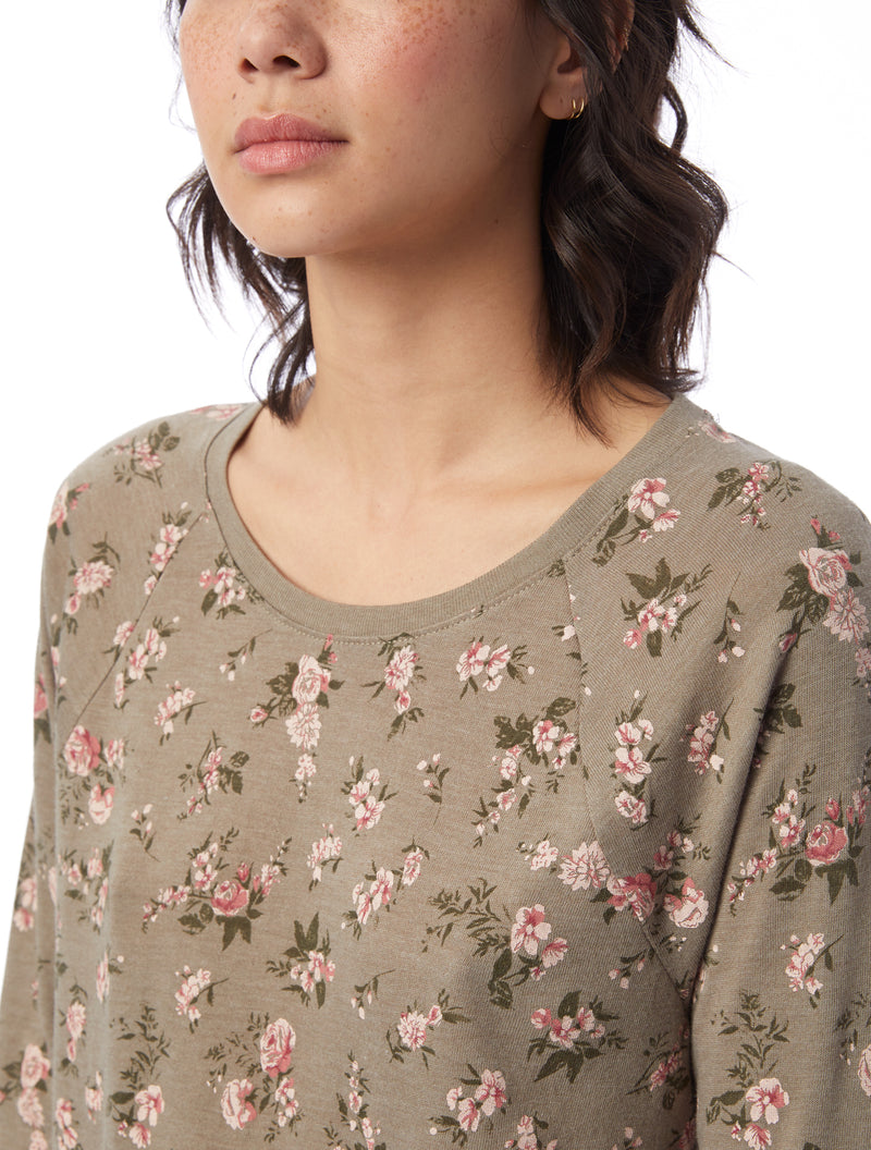 Dark Beige floral printed, relaxed fit tee with 3/4 raglan sleeve and slight shirttail hem.