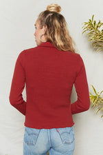 Merlot long sleeve top has fitted body and sleeves with collar and button placket.