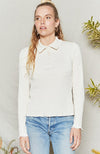 Natural long sleeve top has fitted body and sleeves with collar and button placket.