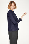 Navy Blue denim sweatshirt in simple shape, with feminine ties at the sleeves and a relaxed funnel neck.