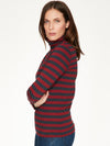 Ruby Red/Midnight Navy striped roll turtleneck with relaxed, feminine fit and long sleeves. 