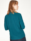 Kingfisher Blue top with twist neck slit detail and long cuffed sleeves.