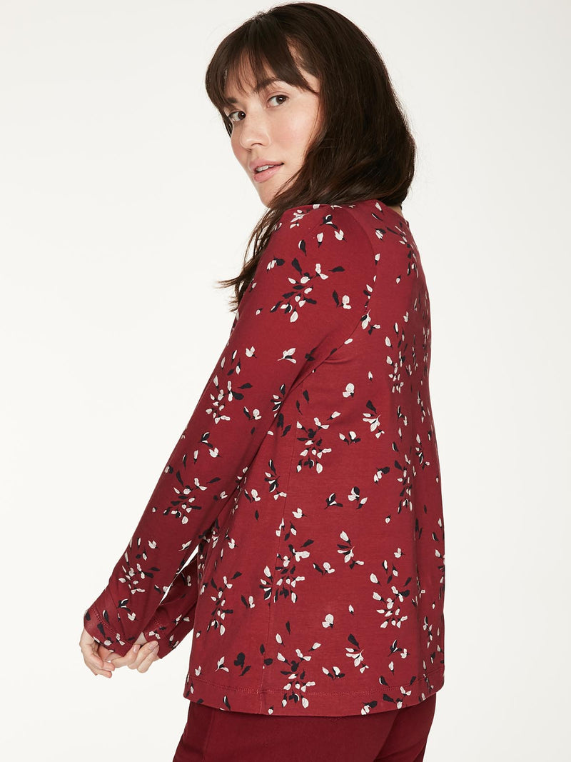 Ruby Red relaxed fit long sleeve top, with pleat detailing at front neckline and shoulder. Features a hand painted floral print.